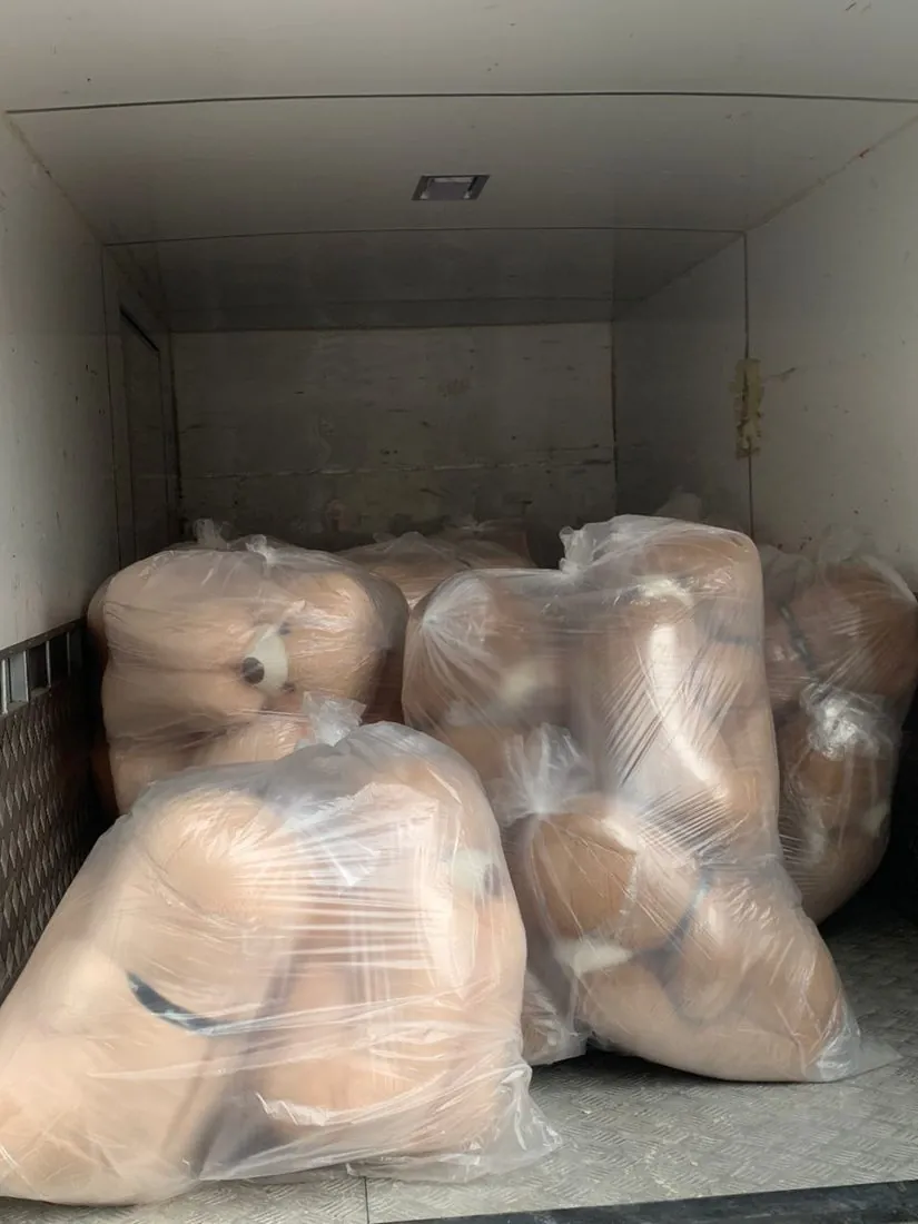 Bulk teddy bears loaded into a lorry for delivery