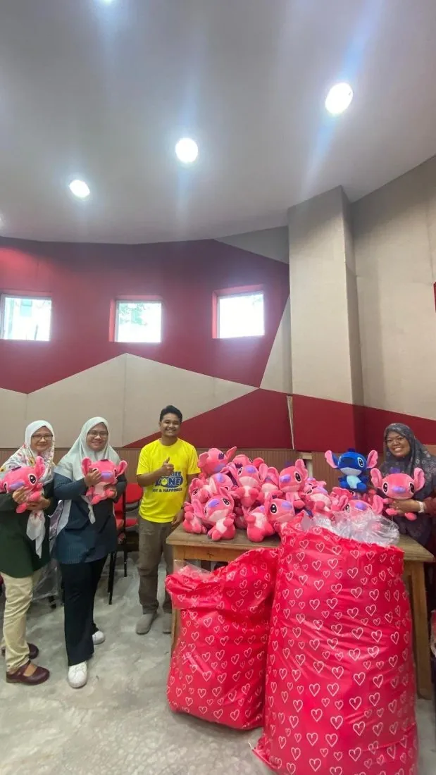 Bulk plush gifts handed over at a corporate event